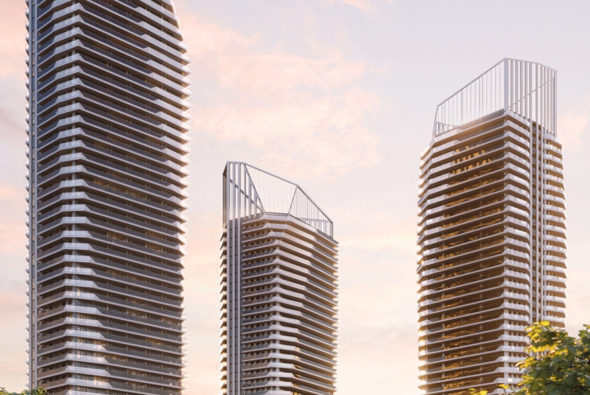 Three new condos in Gta, towering buildings with trees in the background.