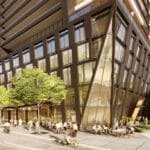 An artist's rendering of new homes in Gta with people walking in front of it.