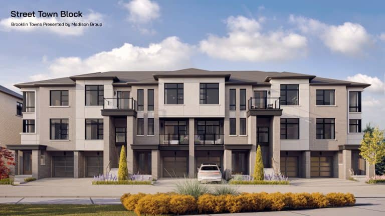 Brooklin Towns, a modern townhouse complex with three stories and multiple units, is showcased under a clear blue sky. The buildings feature large windows, balconies, and neutral-toned exteriors. A white car is parked in front of the central unit, and there is well-maintained landscaping.