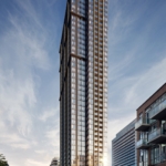 A towering modern skyscraper with sleek glass and steel architecture stands prominently under a partly cloudy sky. The building displays an elegant, grid-like facade with various reflections. Nearby, smaller buildings line the street, which has light traffic and several signs advertising new homes in GTA.