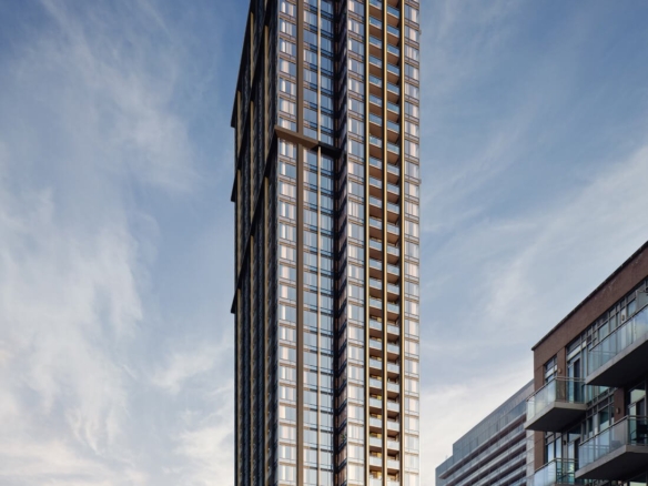 A towering modern skyscraper with sleek glass and steel architecture stands prominently under a partly cloudy sky. The building displays an elegant, grid-like facade with various reflections. Nearby, smaller buildings line the street, which has light traffic and several signs advertising new homes in GTA.