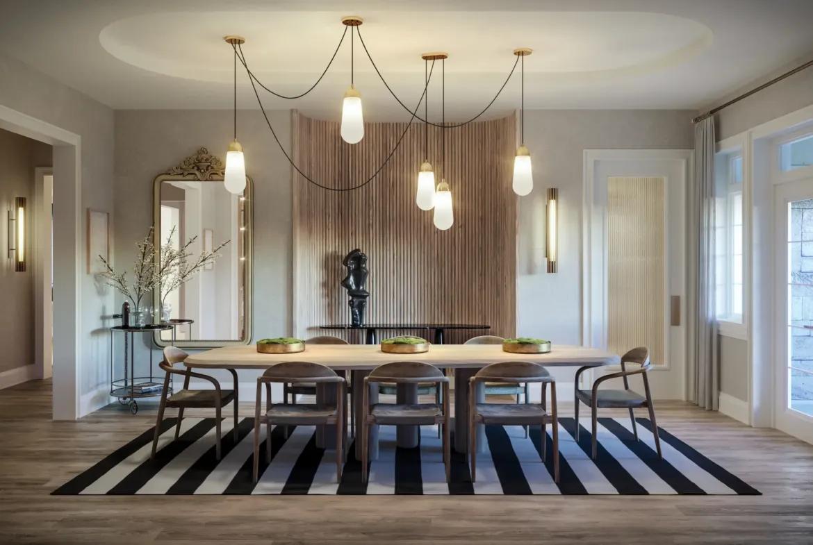 A modern dining room in one of the elegant new homes in GTA features a large wooden table with eight chairs, set on a black-and-white striped rug. Pendant lights hang from the ceiling, while the background showcases a wooden accent wall adorned with artwork and decorative items. Large windows provide ample natural light.