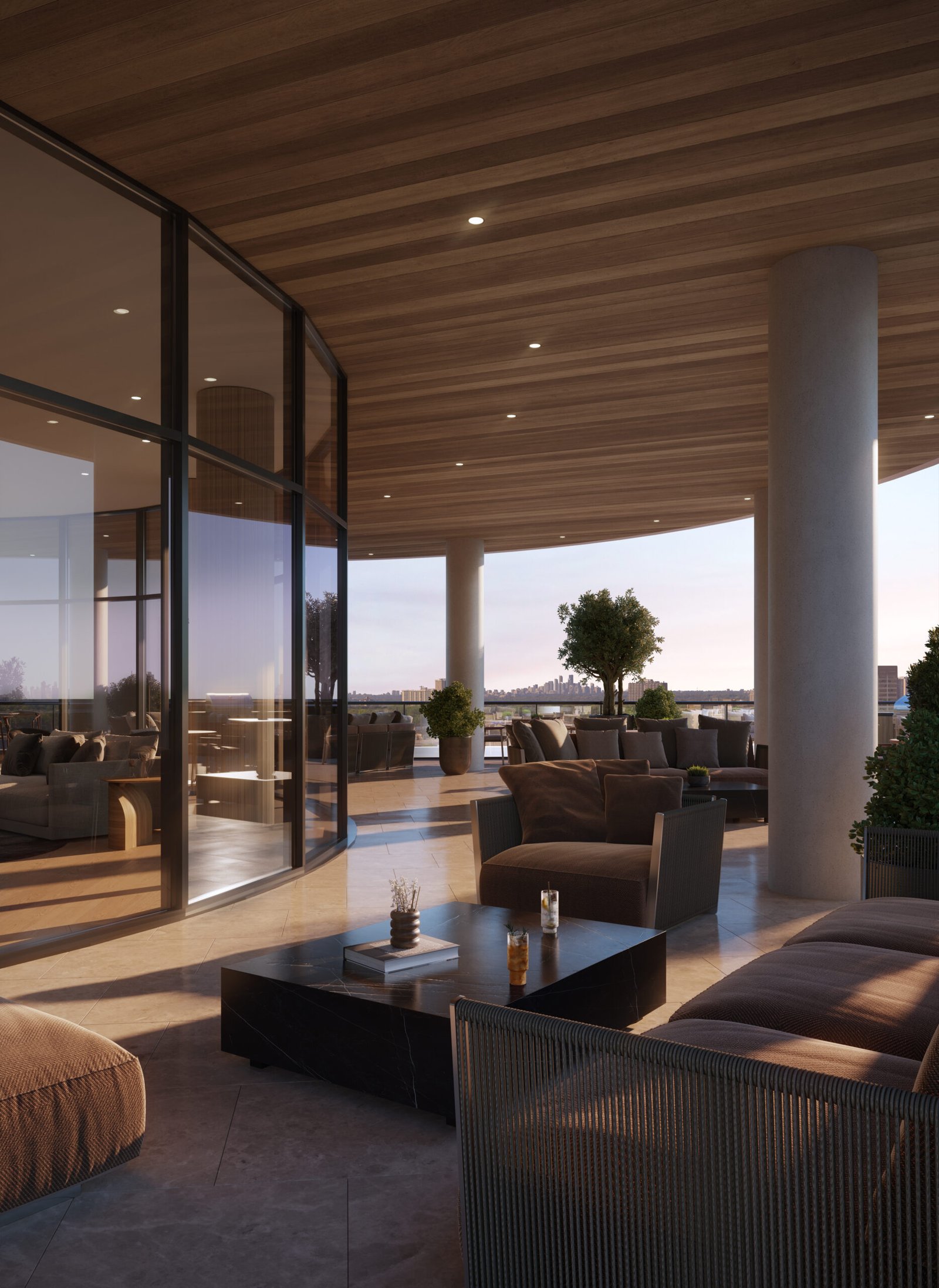 A modern, luxurious outdoor terrace with a wooden ceiling has comfortable seating, potted plants, and glass walls. The sun is setting, casting a warm glow over the scene. Two beverages from LSQ 2 sit on a low table, with distant cityscape views in the background. A modern, luxurious outdoor terrace with a wooden ceiling has comfortable seating, potted plants, and glass walls. The sun is setting, casting a warm glow over the scene. Two beverages from LSQ 2 sit on a low table, with distant cityscape views in the background.