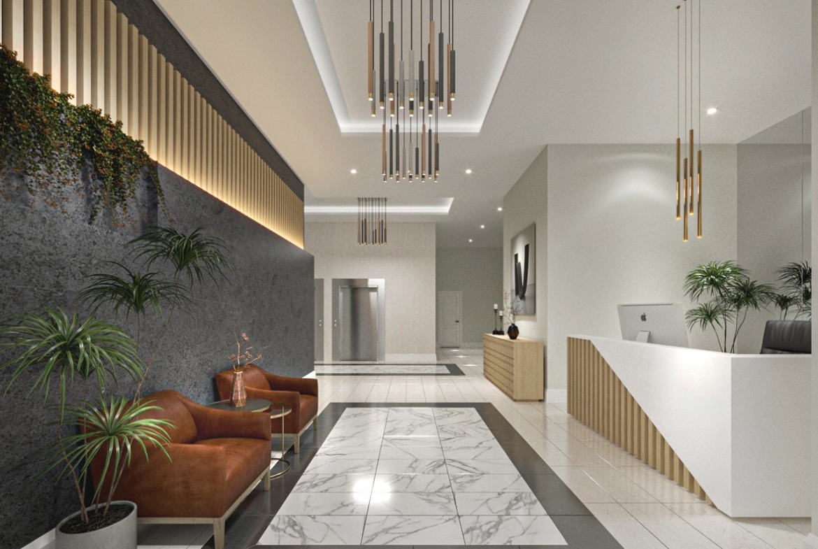 Modern hotel lobby with sleek marble floors, pendant lighting, a reception desk to the right, and a seating area with leather chairs and green plants. Nearby are new homes in GTA.