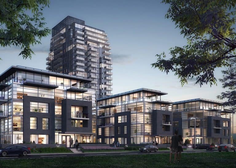 Modern residential complex, Landing Condos, with multiple buildings at dusk. The buildings feature large glass windows and contemporary design. Trees and greenery surround the area, and a few people are seen walking along the pathways while cars are parked nearby near Whitby Harbour.