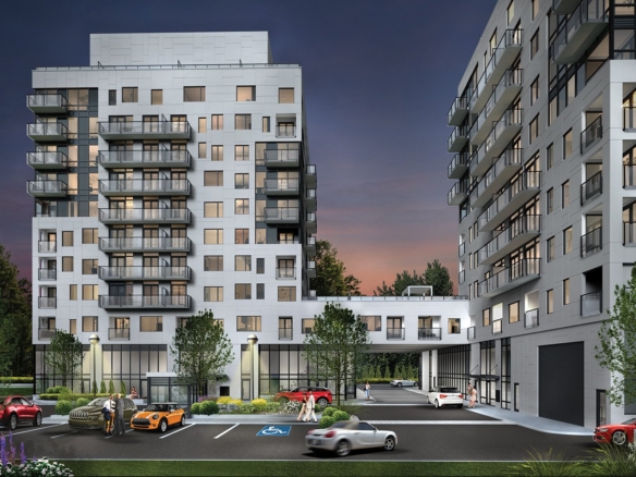 Modern urban residential buildings at dusk with illuminated windows, featuring New condos and Gagan Bector, and a parking lot with cars.