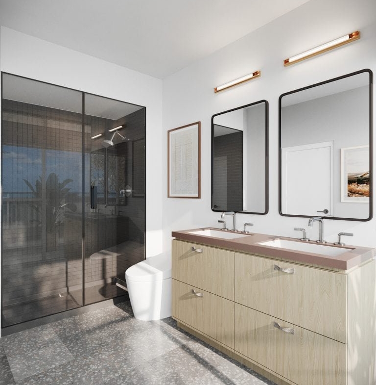 A modern bathroom in a pre-construction home features a double vanity with light wood cabinets and rectangular mirrors, a glass shower enclosure, and a toilet. Artwork hangs on the walls, and a window