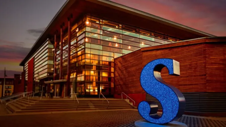 A building with a blue letter "s" in front of it.