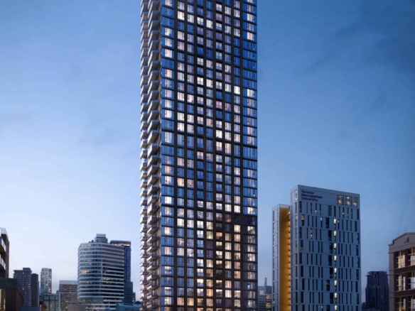 A towering skyscraper with illuminated windows stands against a twilight sky, surrounded by other buildings in a bustling urban area. Streetlights and car trails light up the busy road below, as nearby new condos in the GTA promise luxurious living above the vibrant city scene.