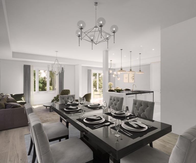 A modern open-plan dining and living area in one of the elegant new homes features a sleek black dining table set for six. The space boasts a contemporary chandelier, light gray walls, large windows, and a view of the kitchen with an island and pendant lights in the background.