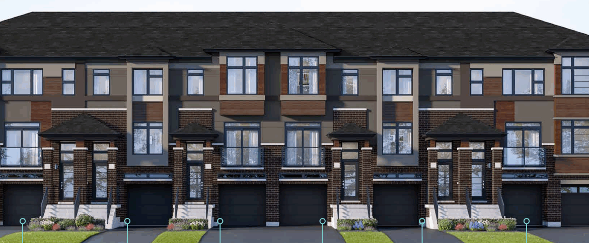 A row of modern townhouses with brown and beige exteriors features large windows and individual driveways. These pre-construction homes boast dark roofs accented with brickwork. Small grass patches adorn the front of each unit, while trees are visible on the right.