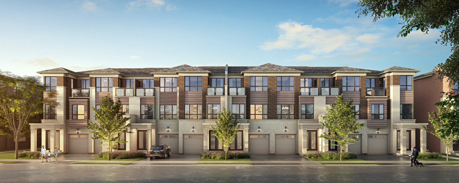 A modern three-story townhouse complex with a brick and siding exterior showcases large windows and balconies. Trees gracefully line the street, while a parked car rests in front. The sky is clear and blue, complementing these new homes in Brampton’s serene setting. A modern three-story townhouse complex with a brick and siding exterior showcases large windows and balconies. Trees gracefully line the street, while a parked car rests in front. The sky is clear and blue, complementing these new homes in Brampton's serene setting.