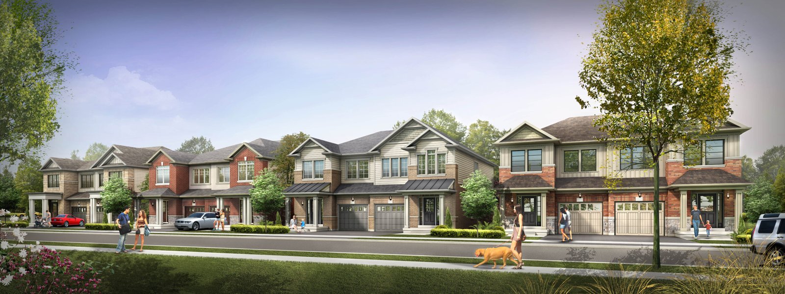 A row of suburban houses with varying architectural styles lines a tree-filled street. People stroll the sidewalk, and a dog is being walked. Cars are parked in driveways and on the street under a clear blue sky, complementing the new homes in Brampton.