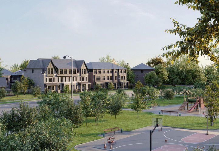 A residential neighborhood with modern townhouses facing a green park. The park features a playground, basketball court, and scattered trees. Nearby, new condos in GTA are under construction. The clear sky suggests a pleasant day.