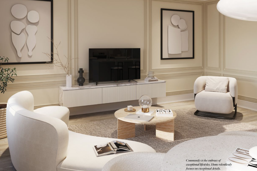A modern living room in new homes features white chairs, a beige sofa, and a round wooden coffee table. A TV is mounted on a wall adorned with abstract art. The decor includes plants and a textured rug, crafting an elegant and cozy space.