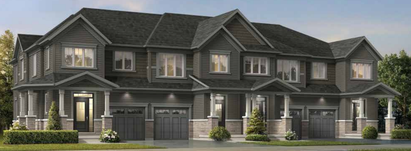 A row of new homes in Brampton features modern townhouses with dark gray siding, multiple windows, and attached garages. These stylish residences are surrounded by small shrubs and a neatly maintained lawn.