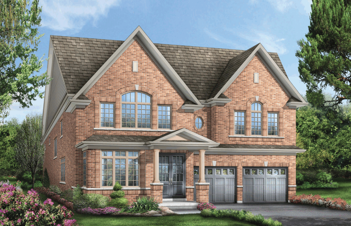 This large two-story brick house boasts a gabled roof, multiple windows, and two garage doors. The front yard is adorned with manicured shrubs and colorful flowers on a well-maintained lawn beneath the clear blue sky—a prime example of new homes in Brampton.
