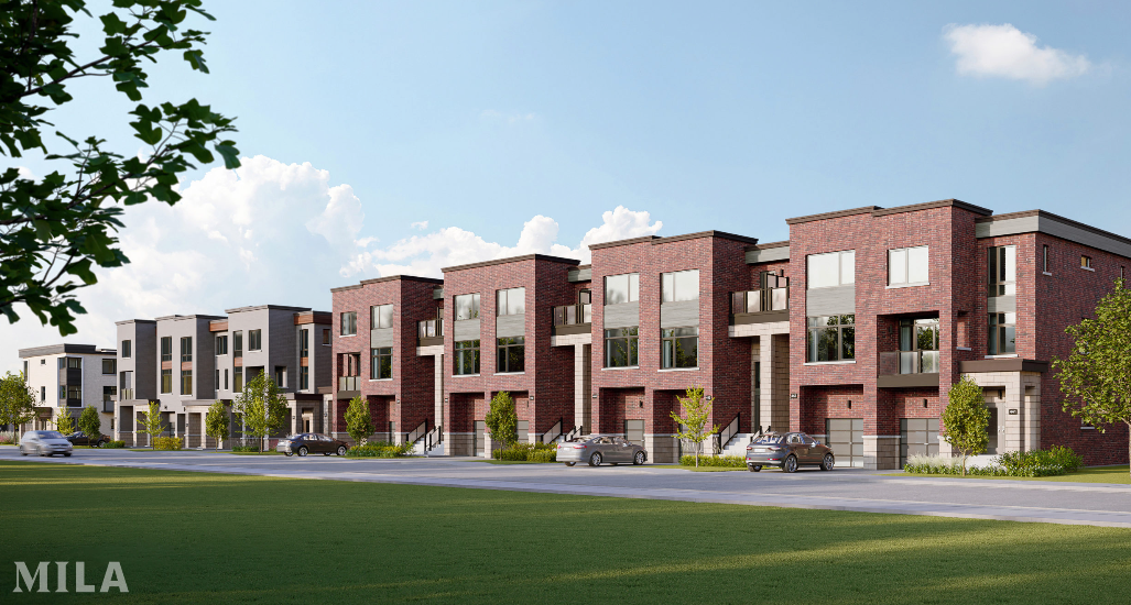 A row of new homes in a suburban neighborhood under a blue sky. These modern, three-story townhouses feature brick facades and large windows. Cars are parked along the street, and small trees line the sidewalk.