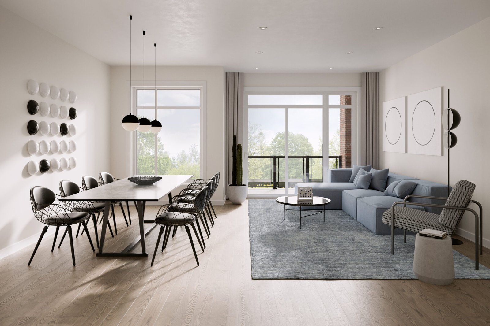 A modern living and dining area featuring a long table with black chairs, a blue sectional sofa, and minimalist decor offers the perfect setting in new homes in Brampton. Large windows bring natural light, while neutral tones with hints of greenery and abstract wall art complete the space.