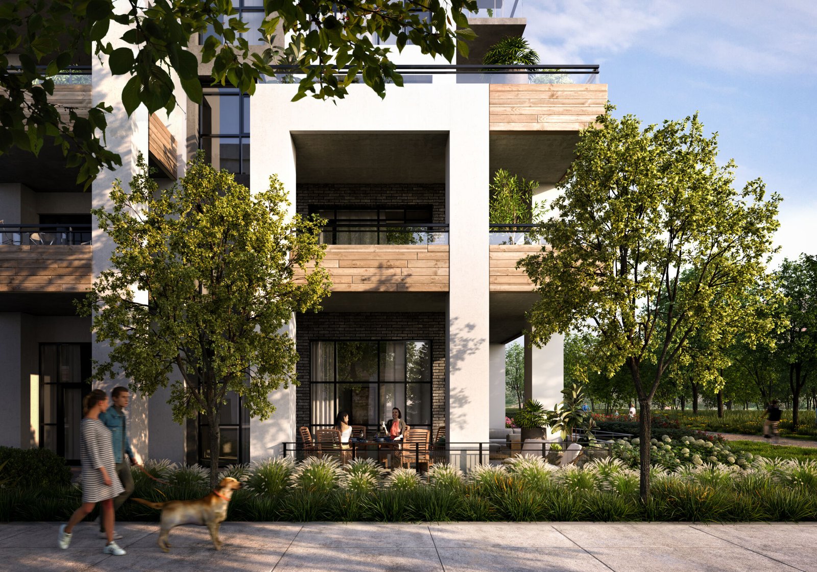 A modern condo building, Mile & Creek, boasts large balconies enveloped by lush trees and greenery. Two people relax on a balcony while another walks their dog on the sunlit sidewalk, creating a blissful scene.