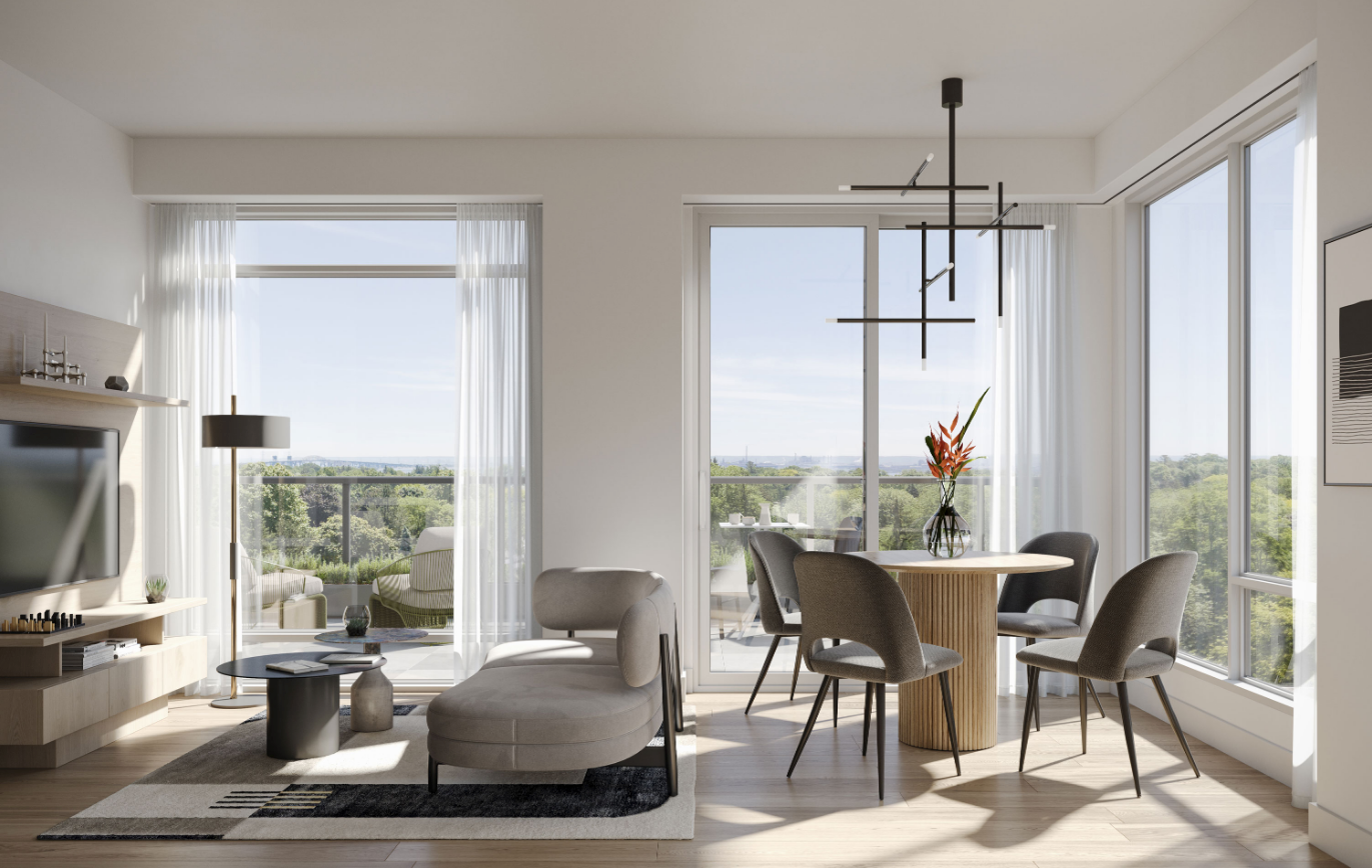 A modern living room with large windows overlooking a scenic view. The room features a cozy sofa, a small coffee table, and a round dining table with chairs. A contemporary chandelier hangs from the ceiling, and a vase with flowers decorates the table—perfect for those exploring new condos in Brampton. A modern living room with large windows overlooking a scenic view. The room features a cozy sofa, a small coffee table, and a round dining table with chairs. A contemporary chandelier hangs from the ceiling, and a vase with flowers decorates the table—perfect for those exploring new condos in Brampton.