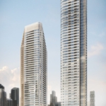 Two modern high-rise buildings, Park Place VMC condos, with sleek, curved designs stand side by side against a clear sky. Surrounded by other skyscrapers and greenery at their bases, the facade reflects light, highlighting the vibrant urban setting.