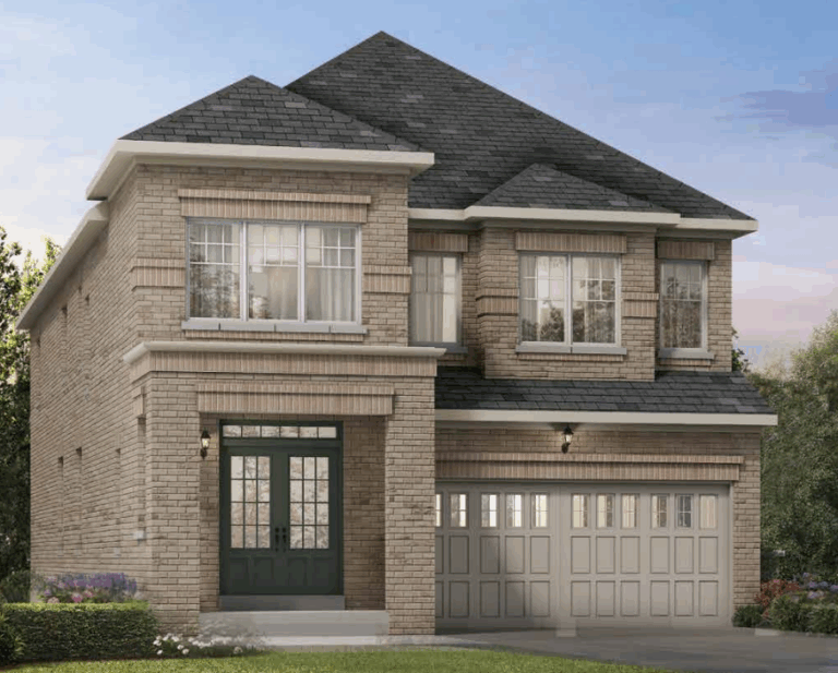 A two-story brick house with a dark gray roof, typical of new homes in Shelburne. It features large windows, a double garage with light gray doors, and a green front door. The front yard has small shrubs and flowers set against a clear blue sky.