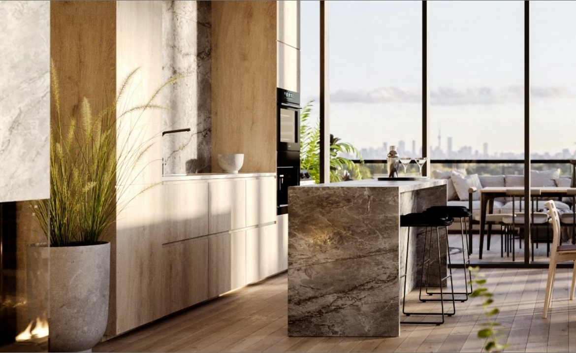 A modern kitchen features marble countertops and wood cabinetry, complemented by a potted plant. Large windows reveal stunning city skyline views. An adjacent dining area with wooden chairs and table completes this bright and open atmosphere, perfect for new homes in Brampton.