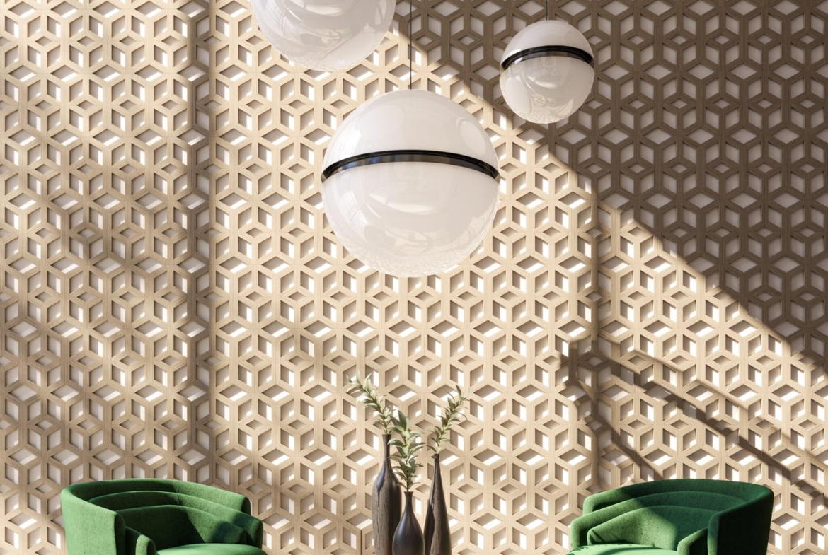 A modern interior with two green armchairs and a round wooden table adorned with vases. Large spherical pendant lights hang from the ceiling against a geometric patterned wall. Sunlight casts shadows, creating a warm and inviting atmosphere, perfect for envisioning new homes in Toronto.