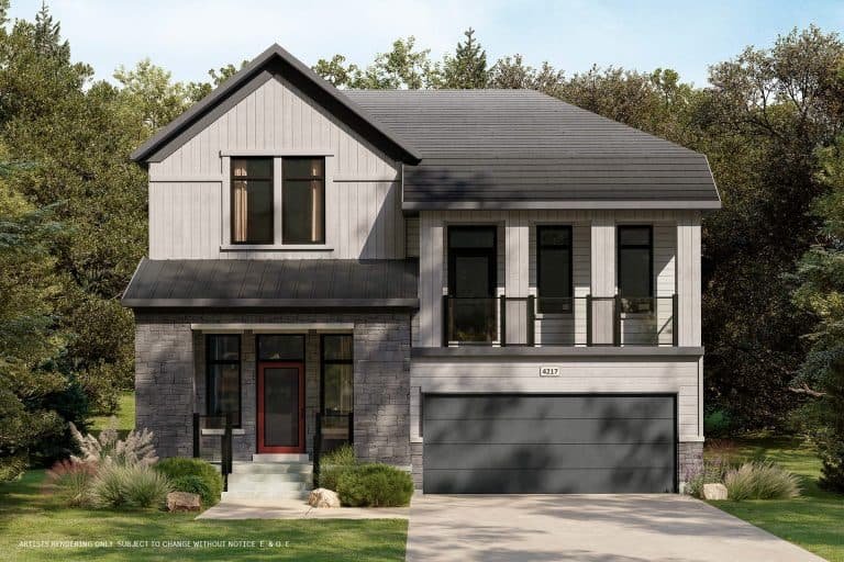 Modern two-story house with a gray stone facade and large windows, nestled within The Conservancy. The house boasts a dark roof, double garage, and a striking red door framed by a small landscaped garden. Lush trees provide the perfect backdrop for this contemporary home.