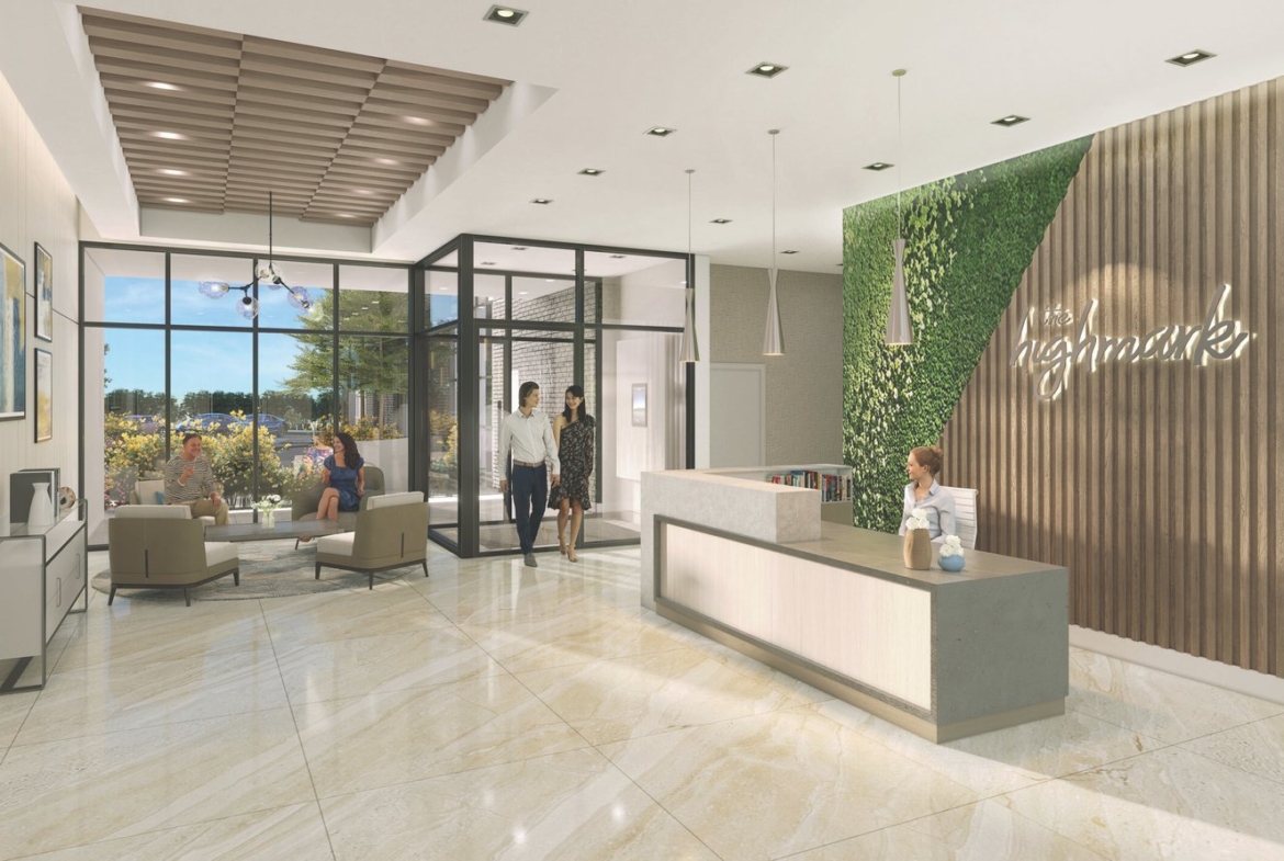The modern office reception area features a receptionist at a desk, three individuals entering through glass doors, and two people seated on sofas. The stylish decor includes a green vertical garden and a wood accent wall with "Highmark." It's reminiscent of new homes in Brampton with its contemporary design.