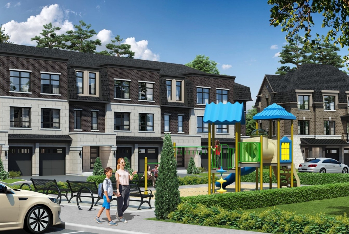 A couple strolls along a path in front of a row of modern townhouses. To their right is a small playground with slides and climbing structures. A car is parked nearby, and trees frame the scene under a clear blue sky, creating an inviting setting for new condos in Brampton.