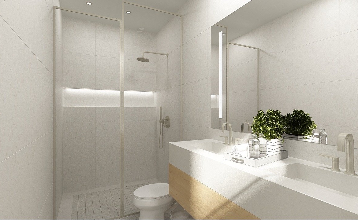 Discover this sleek, modern bathroom in a new home in Toronto. It boasts a spacious walk-in shower with a glass door and a white toilet beside a large countertop with dual sinks. A potted plant injects greenery into the minimalist design, while neutral tones enhance the clean aesthetic.