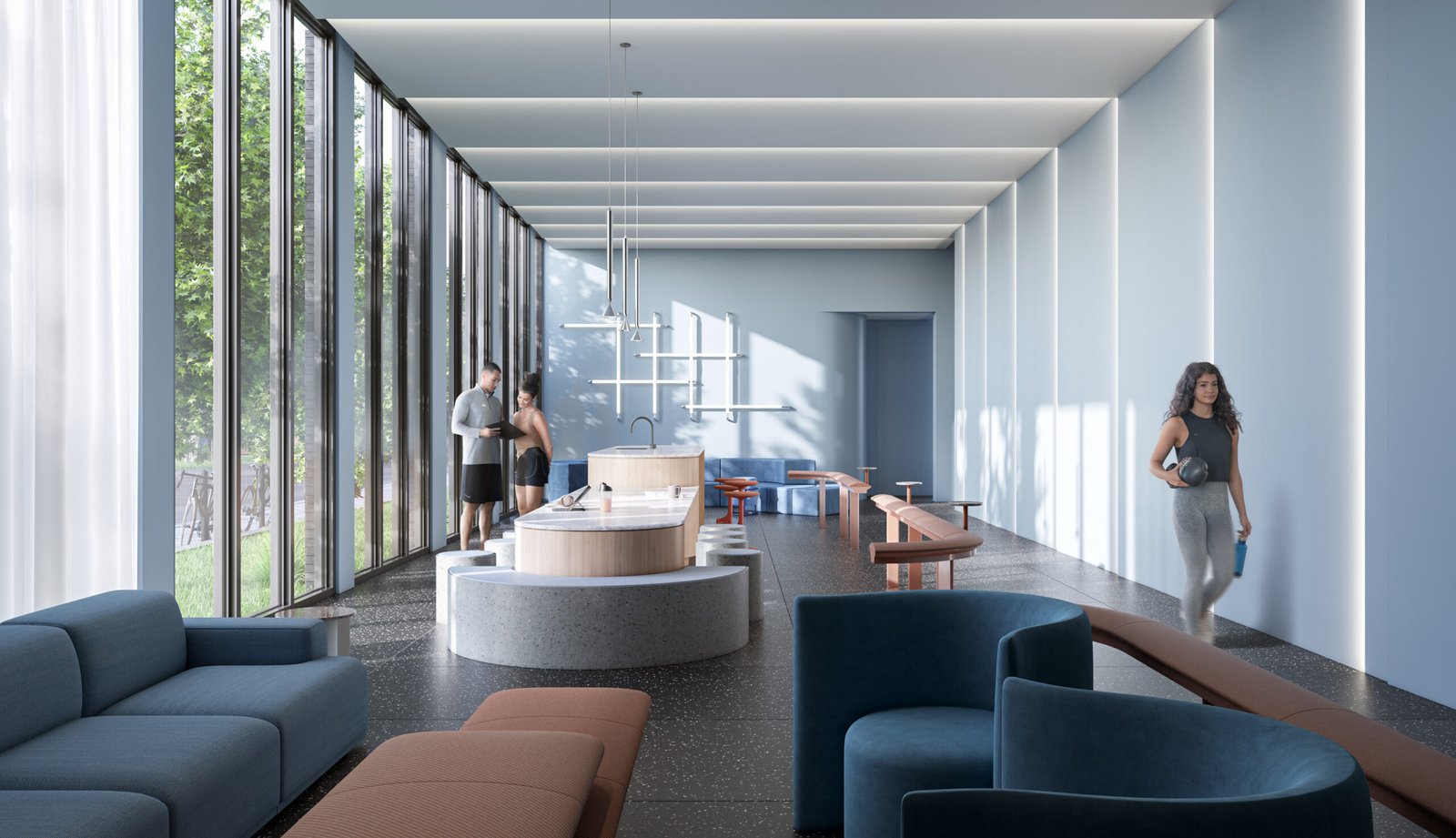 A modern, sunlit lounge in Above Condos boasts large windows and blue and brown seating. It features a long table with minimalist decor. Two people stand at a counter, while another walks by holding a drink. Lush greenery enhances the real estate appeal just outside the windows.