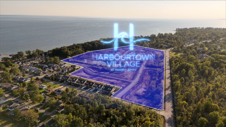 Aerial view of a coastal area with trees and houses. A translucent blue overlay highlights "Harbourtown Village at Waverly Beach," revealing new condos near the shoreline. The ocean shimmers in the background, inviting potential homeowners to explore this picturesque setting by Gagan Bector.