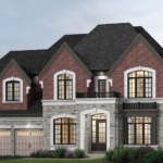 A two-story brick and stone house by Gagan Bector featuring a dark roof. It has arched windows, two garage doors on the left, and a small balcony on the upper right. The surrounding landscape includes bushes and trees, beautifully illuminated with outdoor lighting.