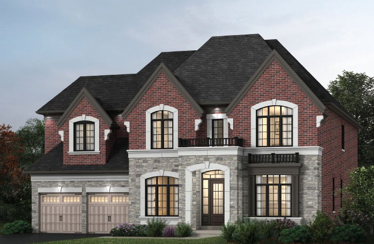 A two-story brick and stone house by Gagan Bector featuring a dark roof. It has arched windows, two garage doors on the left, and a small balcony on the upper right. The surrounding landscape includes bushes and trees, beautifully illuminated with outdoor lighting.