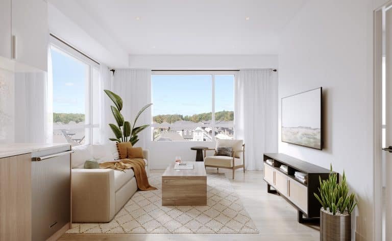 Modern living room in a new GTA home with a beige sofa, wooden coffee table, and flat-screen TV on a stand. Large windows with sheer white curtains offer rooftop and greenery views. A potted plant and decorative rug complete this elegant pre-construction space.