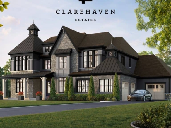 A large, elegant, two-story mansion with modern architecture located in Clarehaven Estates. The house features dark exterior accents, multiple gables, extensive windows, and a spacious garage. A sleek gray car is parked in the driveway surrounded by well-maintained greenery.