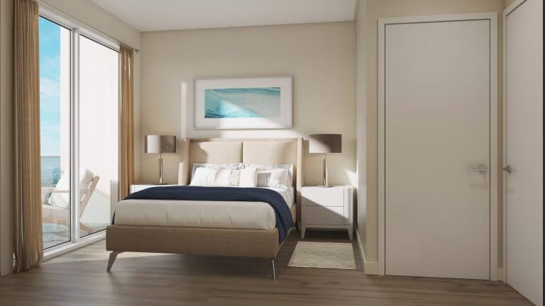 A modern bedroom in the new homes of GTA features a large bed with white and navy bedding. Two matching bedside tables with lamps flank the bed. A seascape painting graces the wall, and to the left, a glass door opens to a balcony with inviting outdoor seating.