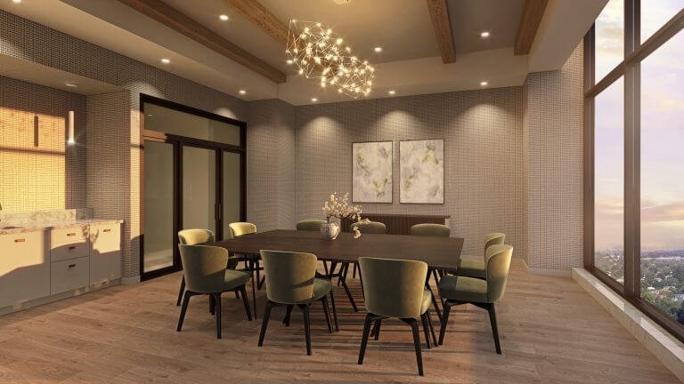 A modern dining room in Gagan Bector features a long wooden table surrounded by green cushioned chairs. A chandelier hangs above, while large windows provide stunning city and sunset views. Two abstract paintings adorn a textured wall, perfectly complementing the elegance of new homes in the GTA.