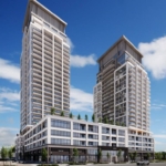 Two modern high-rise buildings with glass facades stand under a clear blue sky. These new condos share a podium featuring commercial spaces and rooftop greenery. In the foreground, an empty street and parking lot await future residents seeking new homes in the GTA.