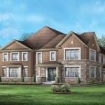 Anchor Woods A two-story brick and stone house in Anchor Woods features multiple tall windows and a gabled roof. The large front yard hosts a manicured garden, while trees surround the property, providing a serene backdrop. The sky is clear with a few clouds, adding to the tranquil setting.