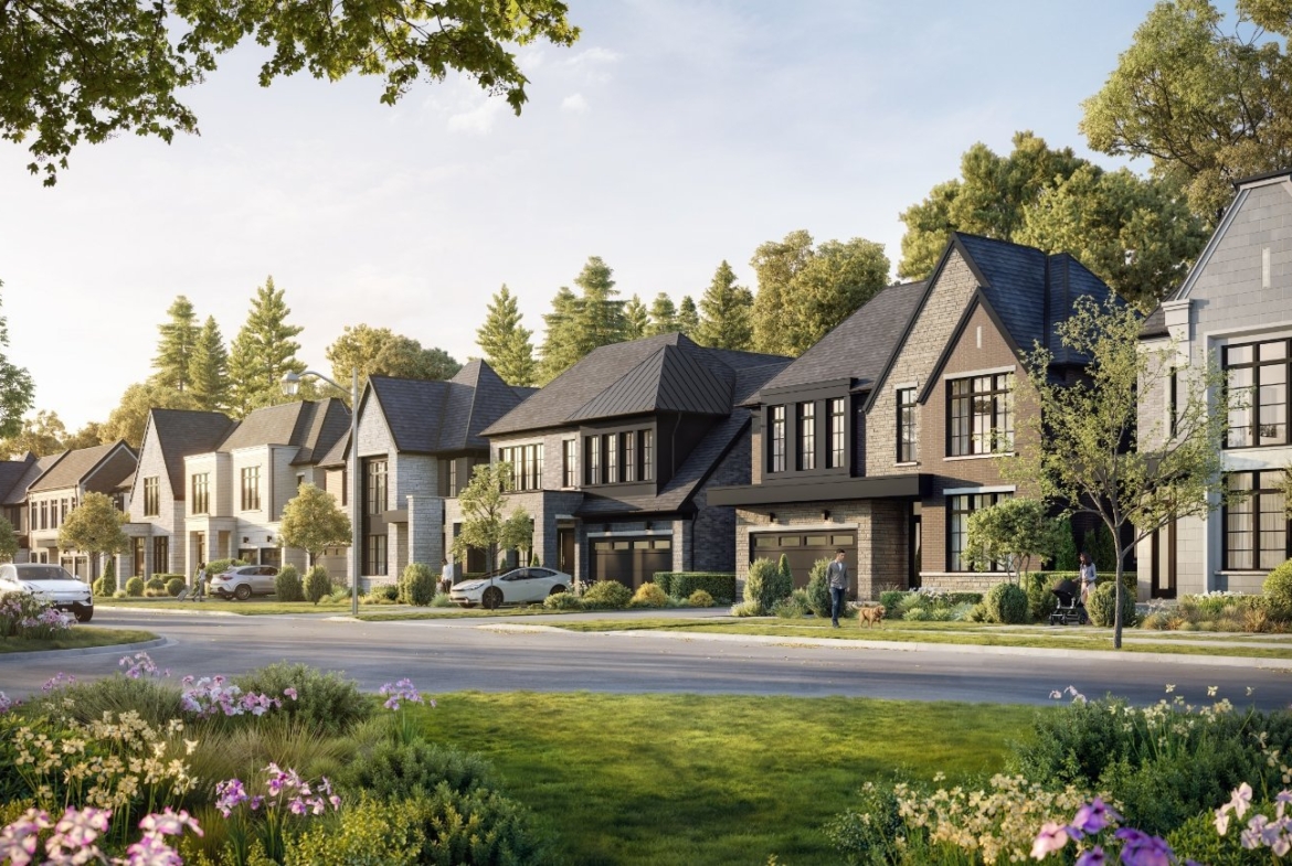 A picturesque suburban street in Iris Estates features a row of modern, two-story houses with well-manicured lawns and various trees and flowers. The sky is clear with soft sunlight casting a serene ambiance. Cars are parked along the street, and a person is walking on the sidewalk.
