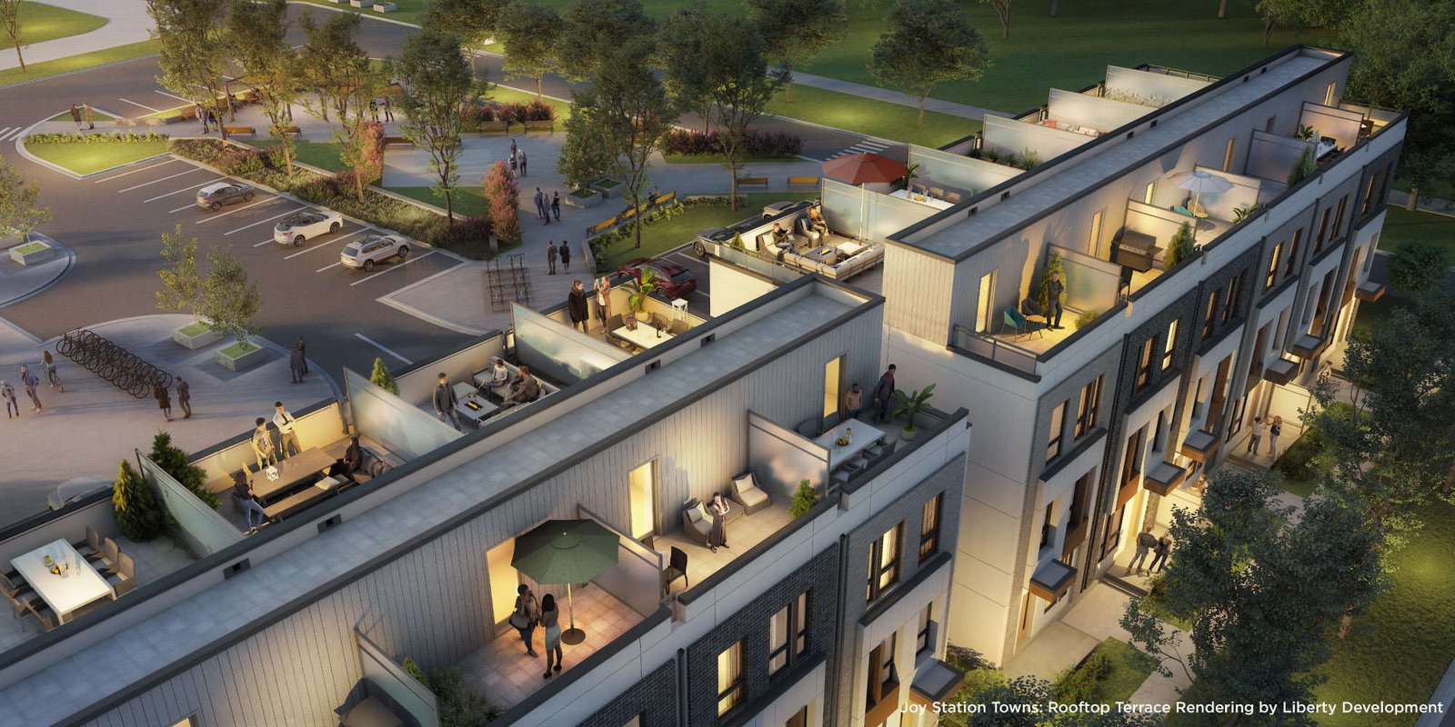 A rooftop terrace rendering of Joy Station Towns depicts modern townhouses with outdoor seating areas, tables, greenery, and people socializing. In the background, a parking area and trees create a lush environment. The scene is set during dusk, with warm lighting enhancing the inviting atmosphere.