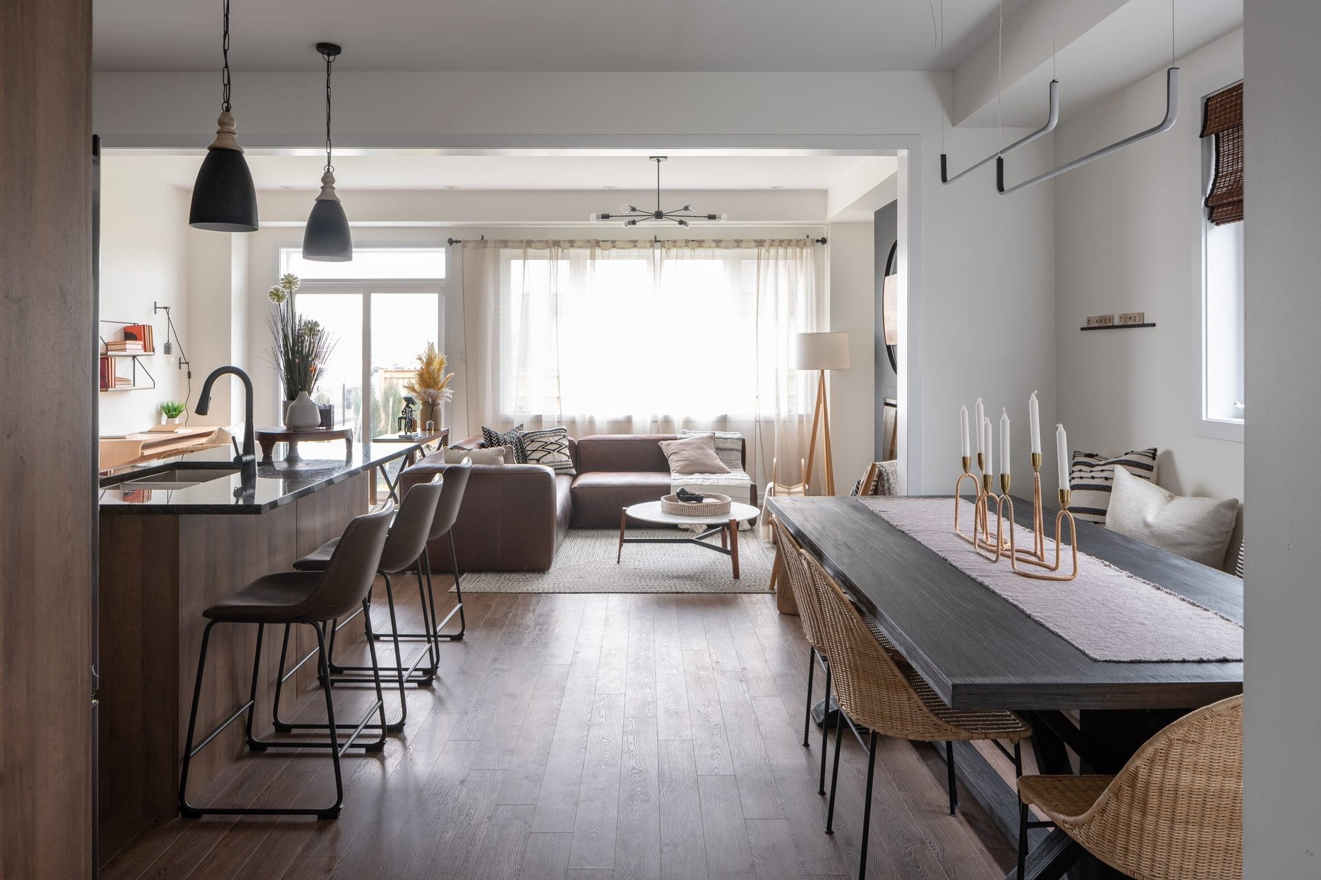 Open-concept chef kitchen with quartz countertops and expansive dining area at Empire Calderwood