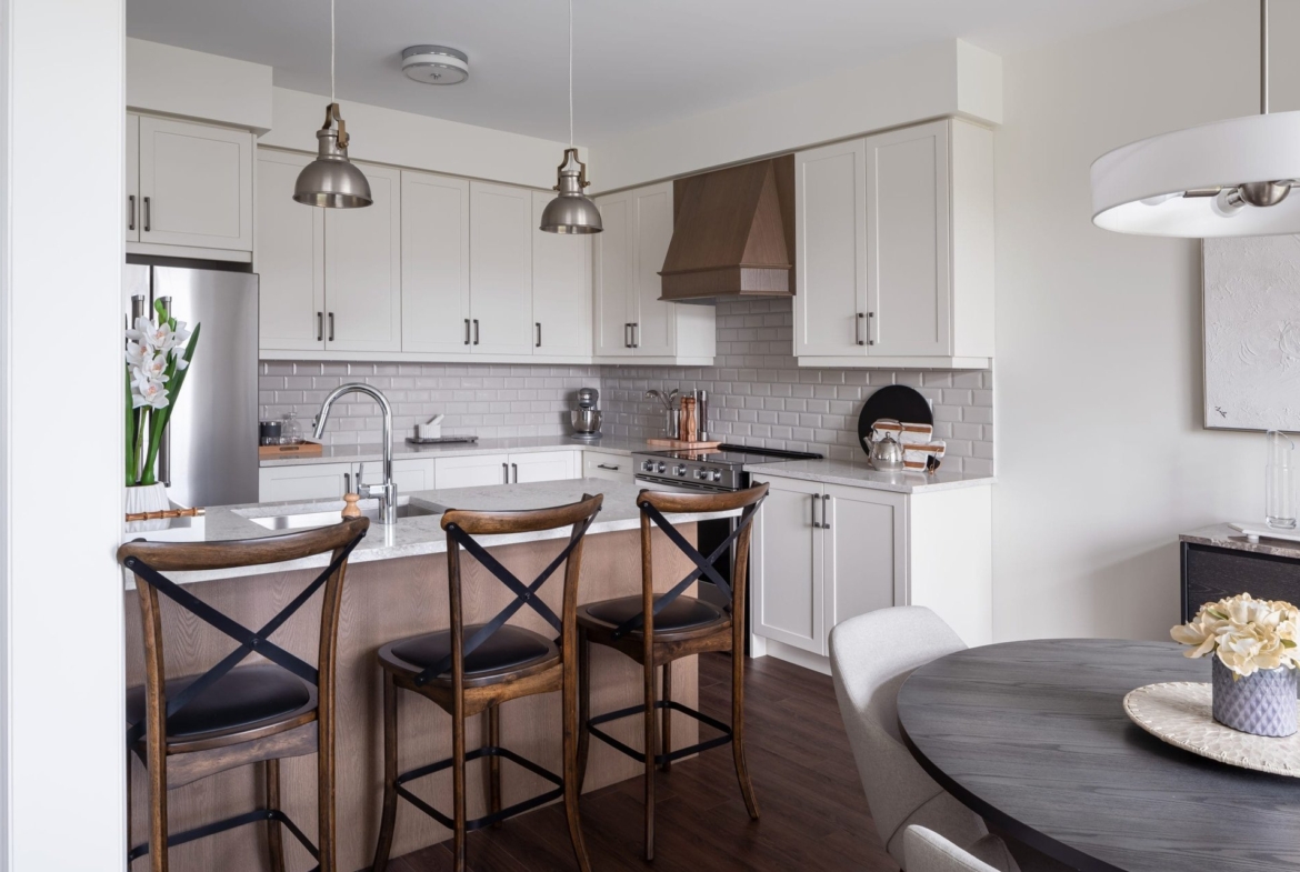 Modern kitchen layout featuring custom cabinetry and premium appliances at Empire Calderwood