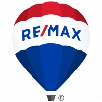 A red, white and blue hot air balloon with the word remax showcases new homes, pre construction homes. A red, white and blue hot air balloon with the word remax showcases new homes, pre construction homes.